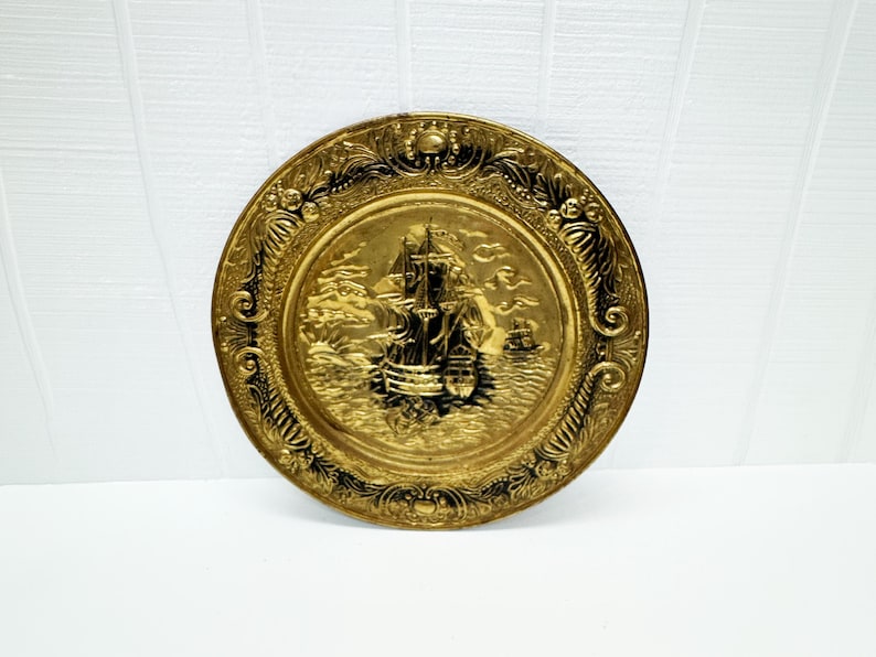 Embossed vintage brass sailing ship wall plaque